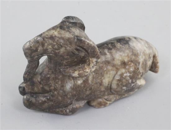 A Chinese grey and black mottled jade figure of a recumbent ram, 18th / 19th century, length 6cm